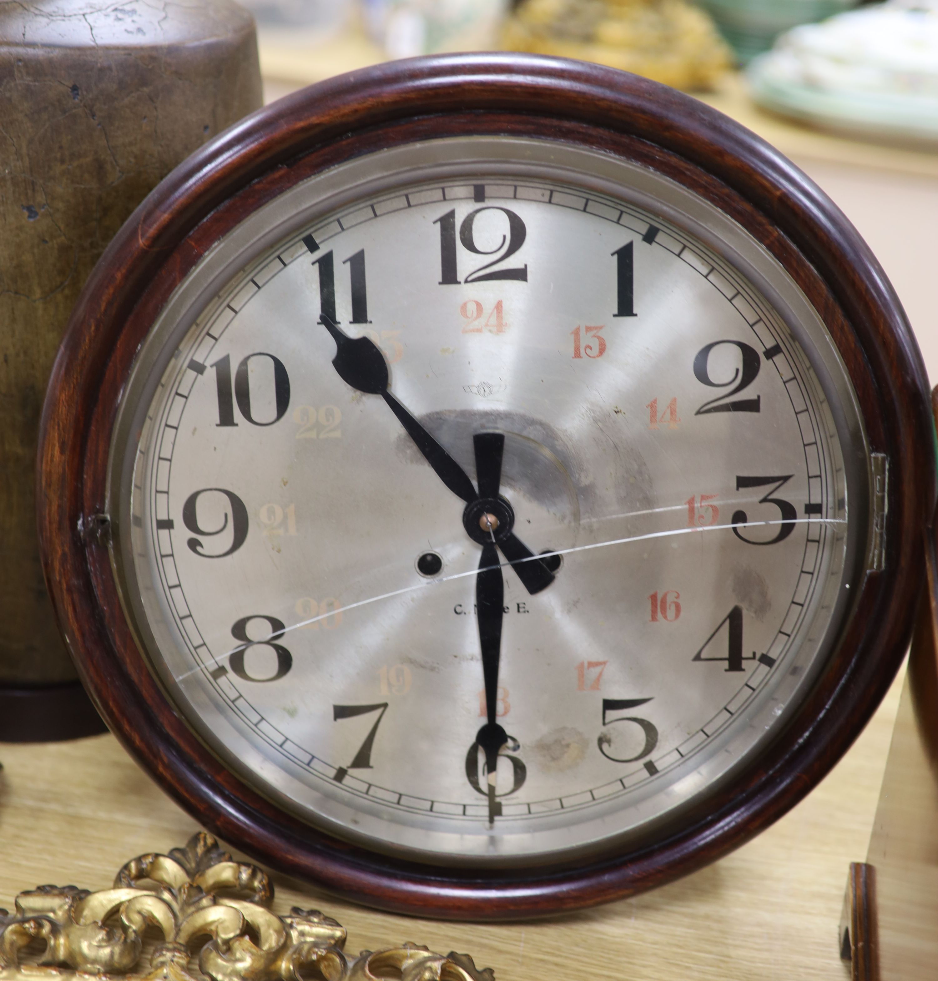 A Victorian mahogany circular eight day wall clock, with silvered dial, diameter 40cm